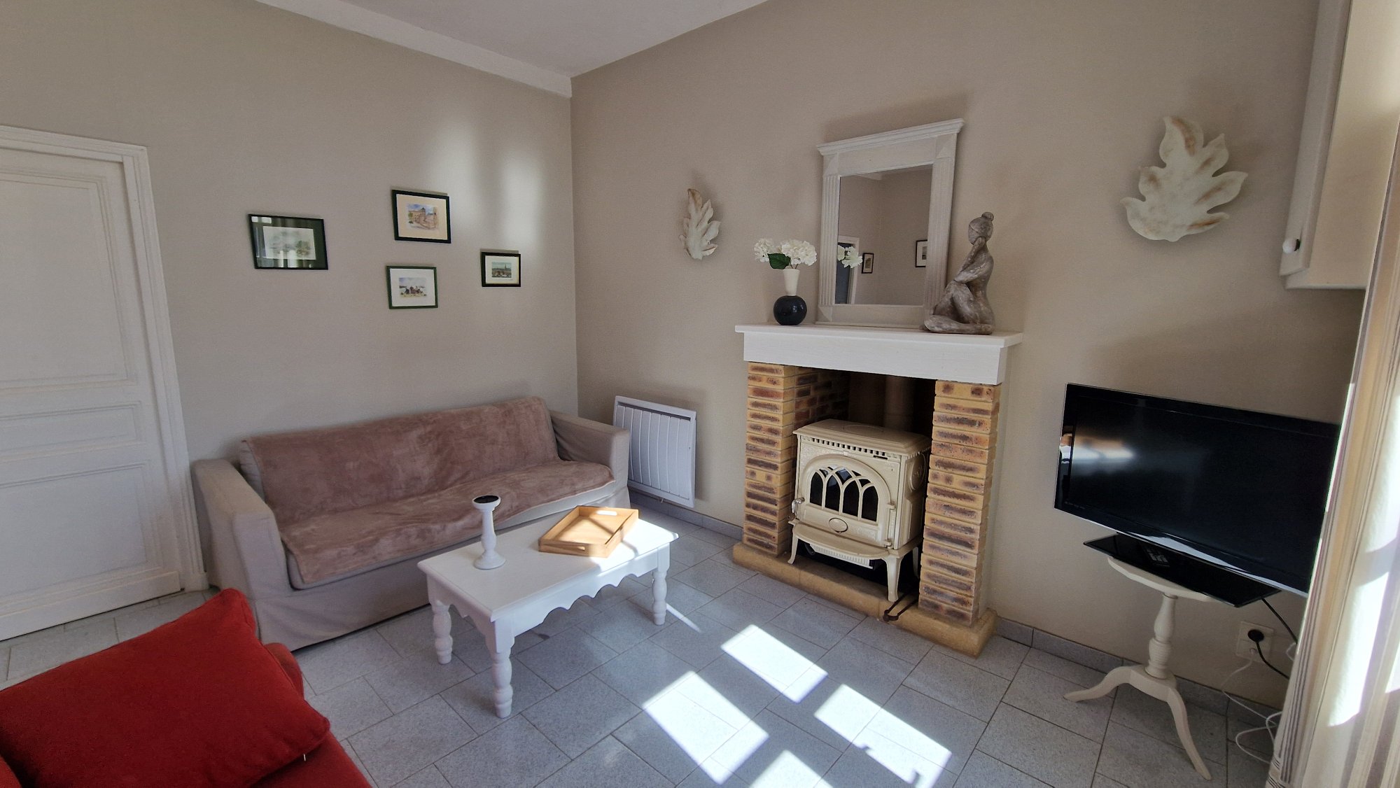 Salon de la maison Les Volets Gris